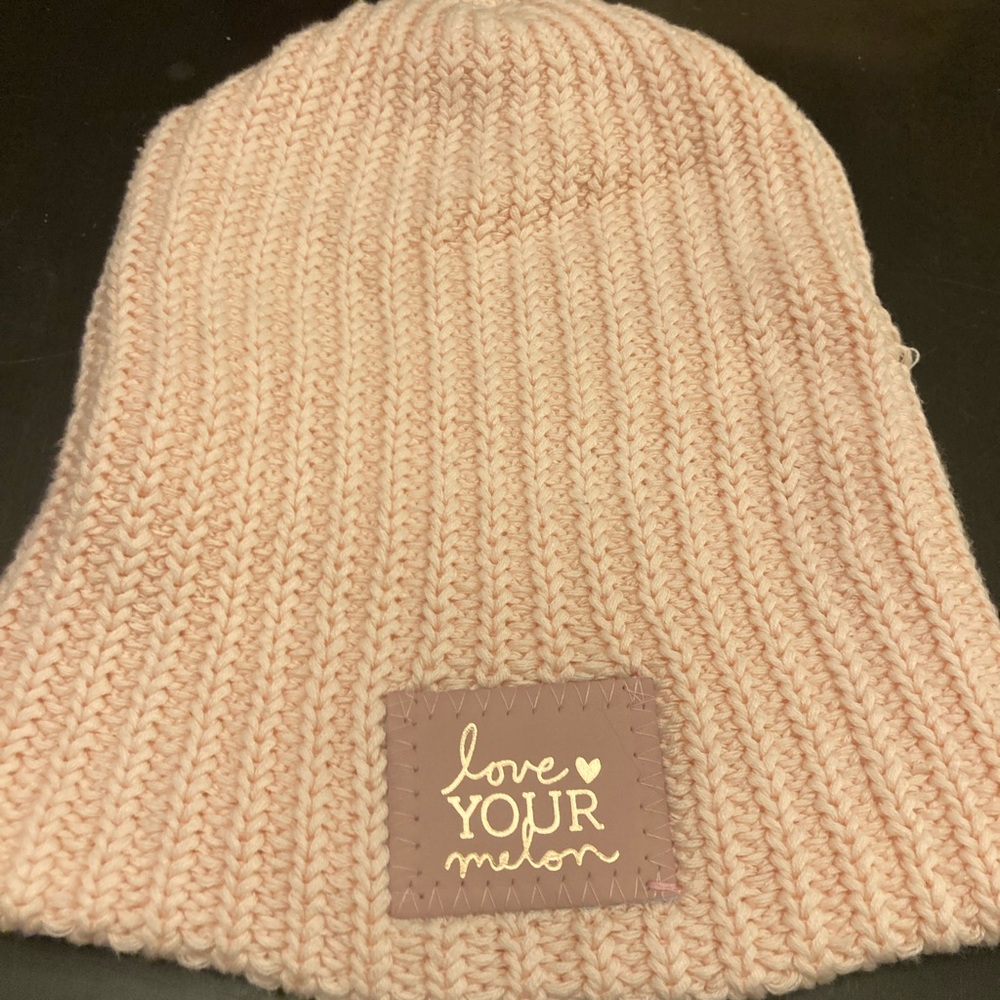 Love Your Melon light pink and rose gold hat.